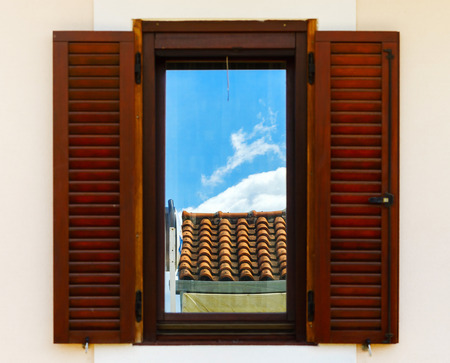 Window with shutters closeup view, sunny day on sea resort, Croatiaの写真素材