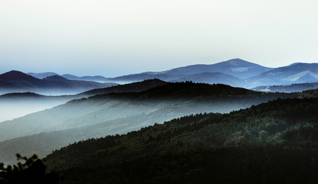Beautiful mountains landscape from the top of the hill with fog, Alsace, Franceの写真素材