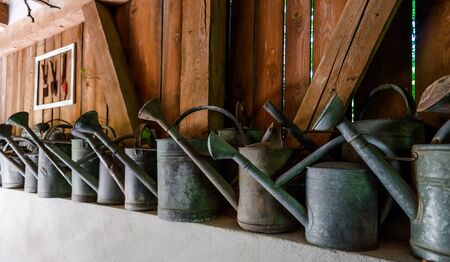 Vintage watering pots using for village house decoration, rural styleの写真素材