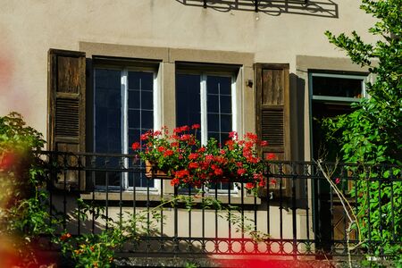 Classic alscien windows with shutters, sunny dayの写真素材