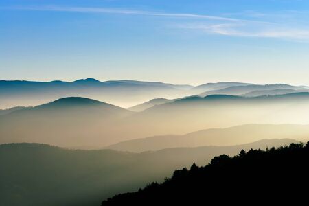 Aerial view of colorful autumnal mountains, foggy sunset, Vosges, Alsace, Franceの写真素材