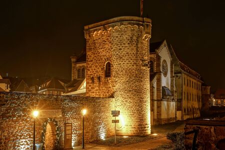 Old medieval fortress wall highlighted at night, Obernai, Franceのeditorial素材
