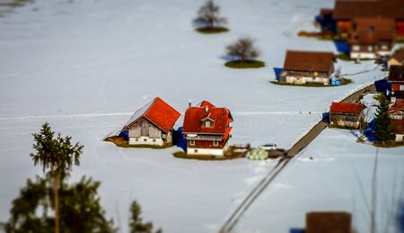 Miniature tilt-shift aerial view of the village in Alps, Switzerlandの写真素材