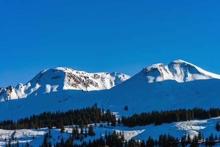 Beautiful mountains in snow. Evening aerial view with shadows.  Switzerland.の写真素材