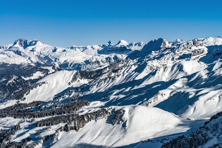 Beautiful mountains in snow. Evening aerial view with shadows.  Switzerland.の写真素材