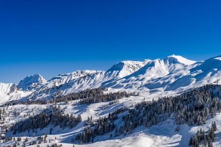 Beautiful mountains in snow. Evening aerial view with shadows.  Switzerland.