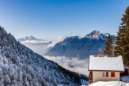 Natural landscape with lonely house in the snow. Alps. Switzerlandのeditorial素材