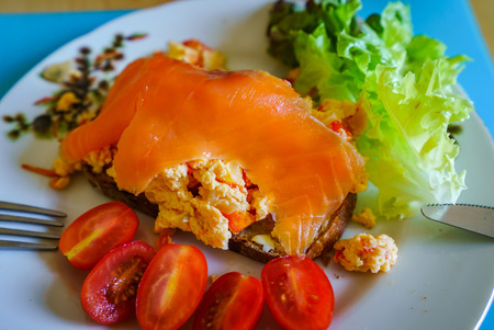 Tasty morning breakfast, omelet, salade, salmon and tomates, natural foodの写真素材