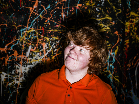 Happiness on the face of funny freckled boy, studio