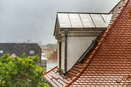 Rainy weather view through the window with water drops on the glass, beauty in nature every dayの写真素材