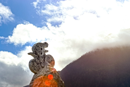 Stoned sculpture of cyclist on blue sky background. Tour de France trace, top point in Spain. Sport conceptの写真素材