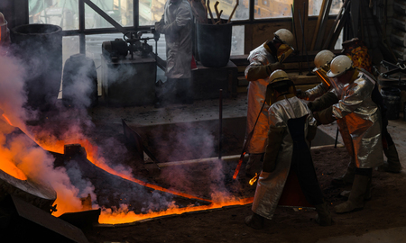 Classic technology of bell producing with melting steel to the ground. Casting new bell for Ebersmunster church in Alsace, Franceのeditorial素材