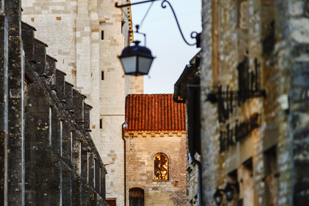 Evening time in old french city Vezelay. Light of old-styled street lantern.. France.のeditorial素材
