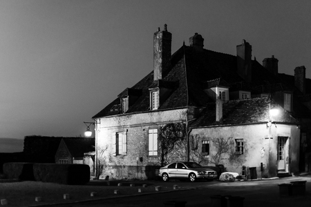 Evening time in old french city Vezelay. Light of old-styled street lantern.. France.のeditorial素材