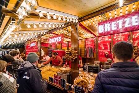 Strasbourg, France - November 24, 2018:   Traditional Christmas market with handmade souvenirs and highlighted streetsのeditorial素材