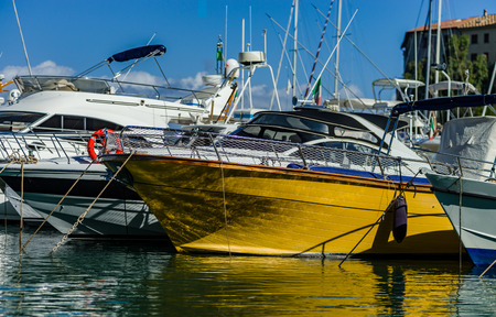 Harbor of big yachts in mediterranean sea, Tuscany, Italyの写真素材