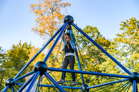 Cute little girl playing on children playground in the park, Strasbourgの写真素材