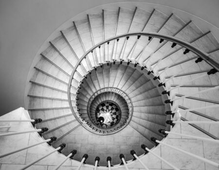 Beautiful circular staircase in old house, snail geometry, black and whiteの写真素材