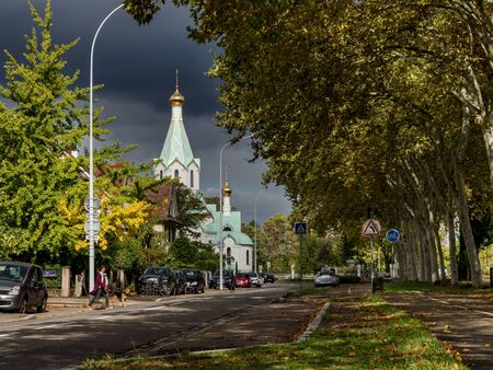 Editorial: 10th Jctober 2019: Strasbourg, France. Orthodox church in Strasbourg, stormy sky and beautiful sunlightのeditorial素材