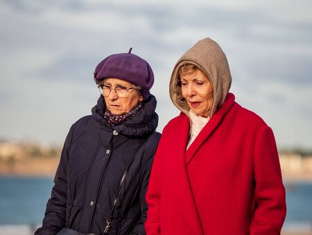 Editorial: 27th October 2019. Saint-Malo, France.  People stroll along the autumn promenade of...