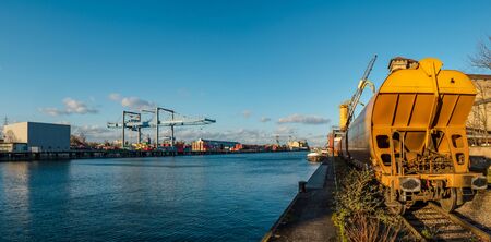 Editorial: 11th February 2020: Strasbourg, France. Cargo port of Strasbourg. Containers, ships and railroad cars. France.のeditorial素材