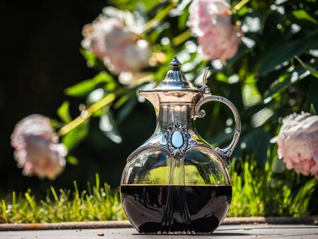 Wine jug made of crystal and silver. Antique item for the table. Elegant rich dishes for decorating a feast. France.の写真素材