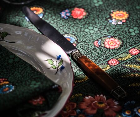A simple but elegant tablecloth and cutlery laid out on it. Crystal glasses in the sun. Everything...