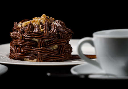 Kiev cake with nuts and chocolate. Close-up photography in a restaurant. Sweet delicious dessert of...