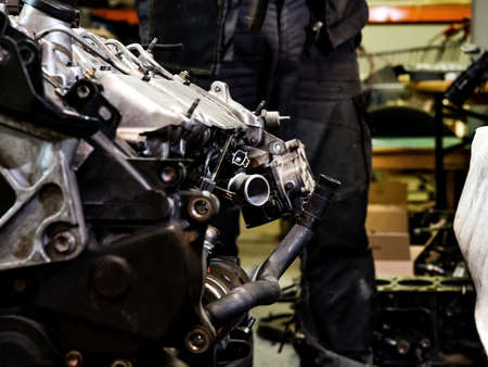 Go through the engine. Renew the engine. Repair the engine. Tools, oil, nozzles, cylinder block, painting, cleaning, repair of diesel internal combustion engine for a car.の写真素材