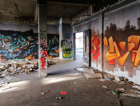 Editorial: 7th March 2021: Strasbourg, France. Old factory buildings. Ruin. The walls are painted with graffiti, broken glass on the floor, the roof is full of holes.のeditorial素材