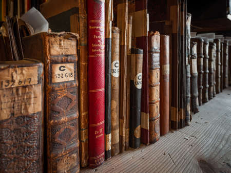 Antique books in the depositories of the Strasbourg library. History, learning, an opportunity to touch the past.のeditorial素材