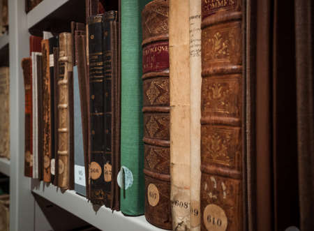 Antique books in the depositories of the Strasbourg library. History, learning, an opportunity to touch the past.のeditorial素材