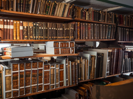 Antique books in the depositories of the Strasbourg library. History, learning, an opportunity to touch the past.のeditorial素材