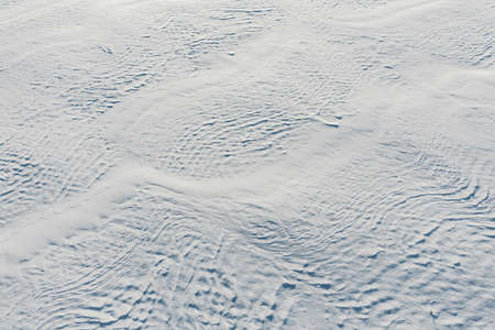 Snow-covered white fields in Alsace, top view. White desert. France.