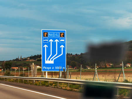 Toll roads in France. Payment at the checkpoint of cars. Paid route.の写真素材