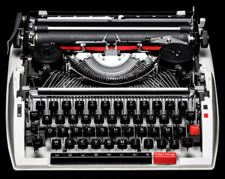 Old vintage typewriter. Two colors: red and black. Stylish rare mechanical thing.の写真素材