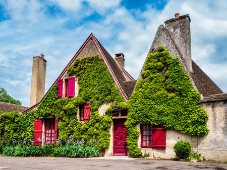 Magnificent view, empty streets of the medieval city of Beaune in Burgundy. The stormy sky emphasizes the contrast with the white stone from which the houses are built. Cozy, cute town. Tourism in France.の写真素材