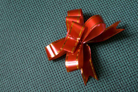 red bow on a green backgroundの写真素材