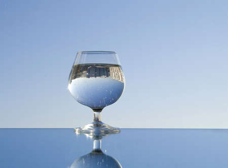 water and glass reflected in a mirror, blue skyの写真素材