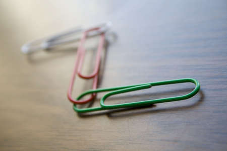 Writing materials: coloured clips background.の写真素材