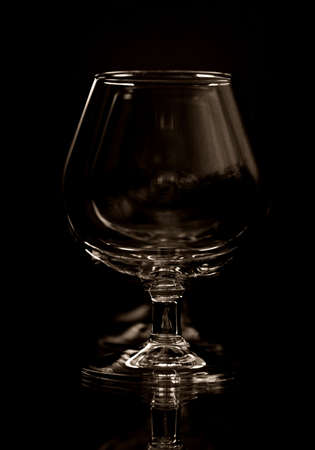 glass on a mirror and reflection black backgroundの写真素材