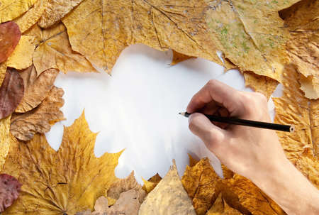 Hand writing on a paper list by black pencilの写真素材