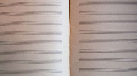 Blank sheet of old yellow music paperの写真素材
