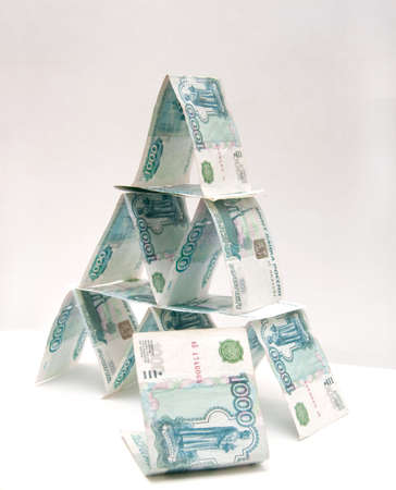 Money pyramid on light backgroundの写真素材