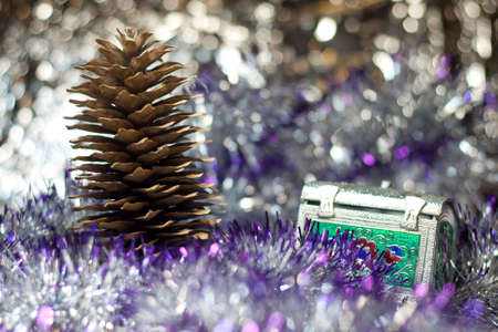 retro silver metal trunk with floral ornament and pine coneの写真素材