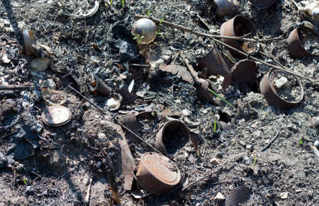 Burnt dump with can glass and over trashの写真素材