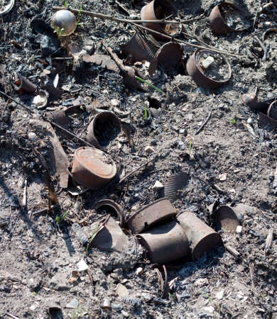 Burnt dump with can glass  and over trashの写真素材