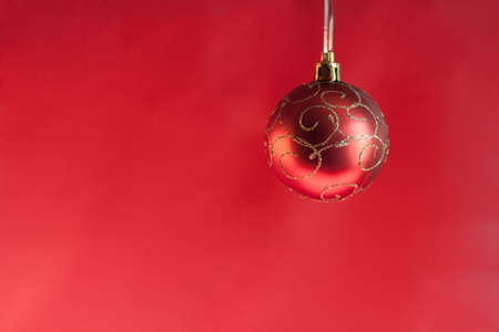 christmas ball on abstract light red backgroudの写真素材