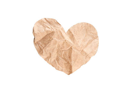 Crumpled brown paper heart on white background, isolatedの写真素材
