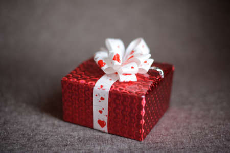 Christmas red gift box on a dark backgroundの写真素材